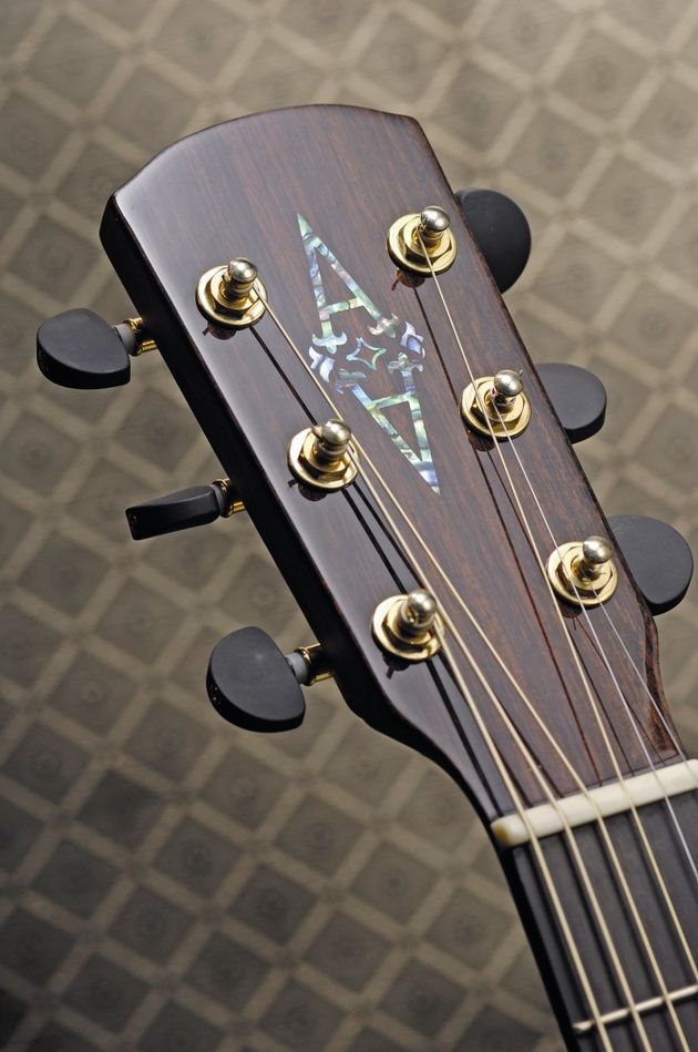 The headstock is adorned with subtle but high quality hardware
